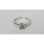 An 18ct white gold 20pt diamond ring