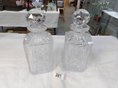 A good quality pair of cut glass decanters
