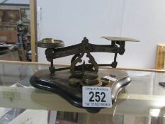 A set of vintage postal scales and weights