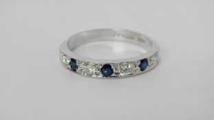 A diamond and sapphire half hoop ring set with 4 diamonds and 3 sapphires in 18ct white gold