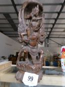 A 19th century carved religious figure from South East Asia