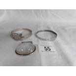 A large silver stone set pendant and 2 silver bangles