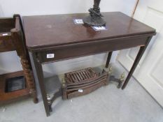 A mahogany fold over table,