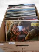 A box of LP records including Bob Dylan, Monkees,