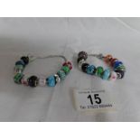 2 Pandora bracelets with assorted charms including Pandora,