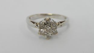 An 18ct white gold floral diamond ring of 50 pts