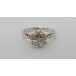 An 18ct white gold floral diamond ring of 50 pts
