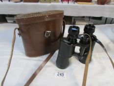 A cased pair of Magnor 10 x 40 binoculars