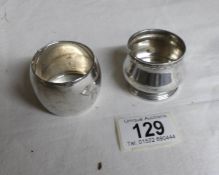 A silver napkin ring and a silver mustard pot,