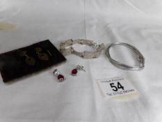 2 pairs of silver earrings and 2 silver bangles