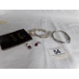 2 pairs of silver earrings and 2 silver bangles