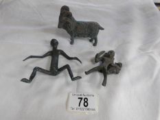 2 antique metal figures and a metal ram