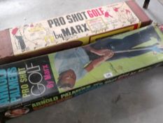 An Arnold Palmer gold game and one other both by Marx