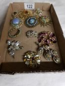 A collection of 12 vintage brooches