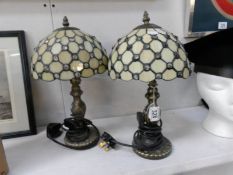 A pair of table lamps with Tiffany style shades