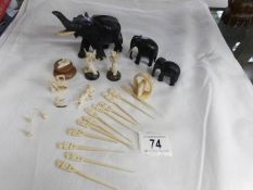 A set of 3 graduated ebony elephants and other items