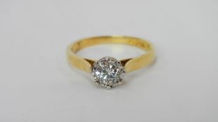 An 18ct gold solitaire half carat diamond ring