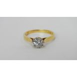 An 18ct gold solitaire half carat diamond ring