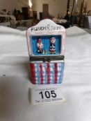 A ceramic punch and judy match holder