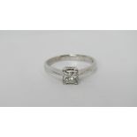 An 18ct white gold three quarter carat diamond solitaire ring