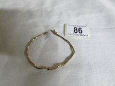 A white stone set 9ct gold bracelet