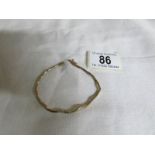 A white stone set 9ct gold bracelet