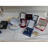 A mixed lot of costume jewellery including earring and necklace sets, brooches,