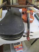 A cased violin and bow