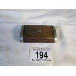 An old teak snuff box inlaid with metal