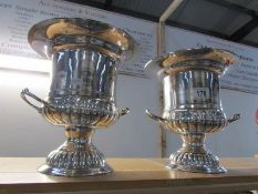 A matching pair of silver plate wine coolers