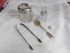 A pair of Georgian silver sugar tongs, a silver spoon,