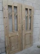 A pair of pine glazed doors