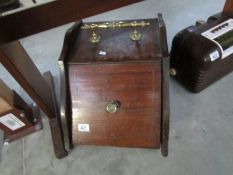 A wooden coal box