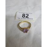 A yellow metal ring set amethyst,