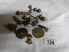 A collection of military badges and buttons