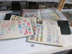 9 albums of assorted stamps