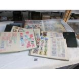 9 albums of assorted stamps