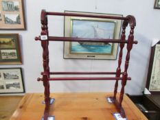 A mahogany towel rail