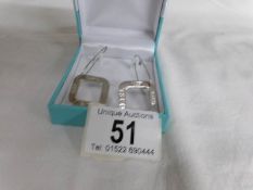 A pair of 925 silver earrings,