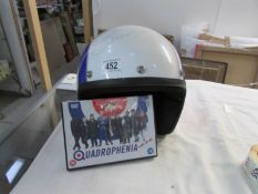 A signed Quadrophena style helmet by Phil Daniels,