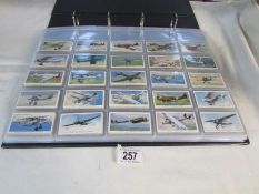 A large album of cigarette cards