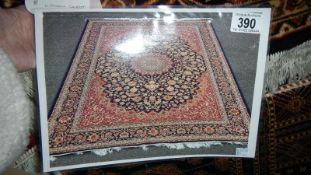 A blue ground Keshan rug,