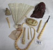 A mixed lot of old bone and ivory items