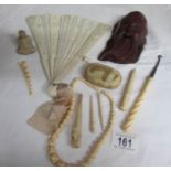 A mixed lot of old bone and ivory items