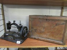 An old sewing machine in original case