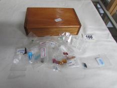 A box of loose gemstones