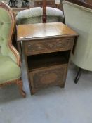 An oak drop side cabinet