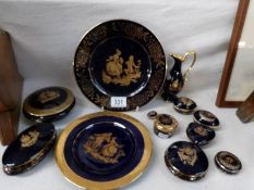 A deep blue and gilt collection of Limoges china