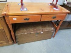 A 2 drawer pine table