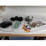 A tribal beaded necklace and other jewellery